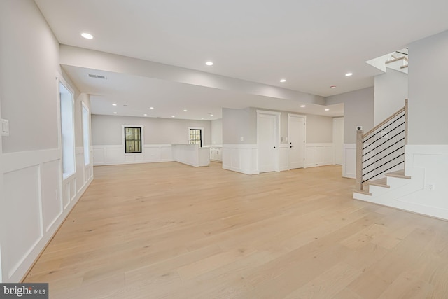 unfurnished living room featuring light hardwood / wood-style floors