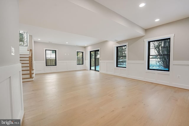 unfurnished living room with light hardwood / wood-style floors