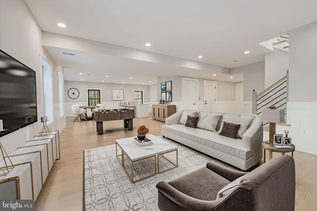 living room with light hardwood / wood-style flooring
