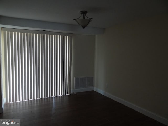 spare room featuring hardwood / wood-style flooring