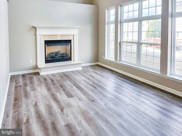 unfurnished living room with light hardwood / wood-style flooring