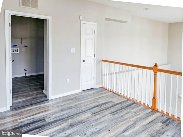 unfurnished room with light hardwood / wood-style floors