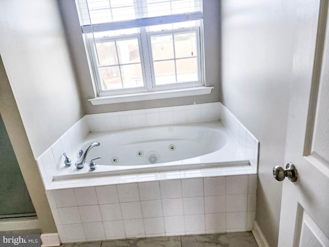 bathroom featuring plenty of natural light and plus walk in shower