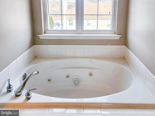 bathroom with tiled bath