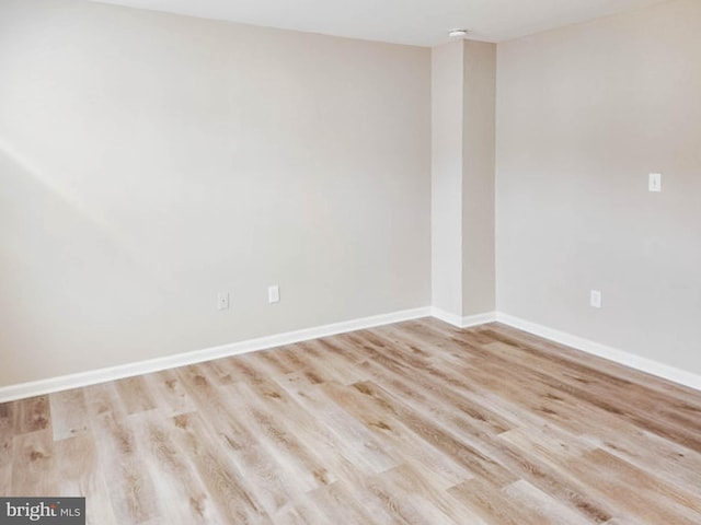 spare room featuring light hardwood / wood-style flooring