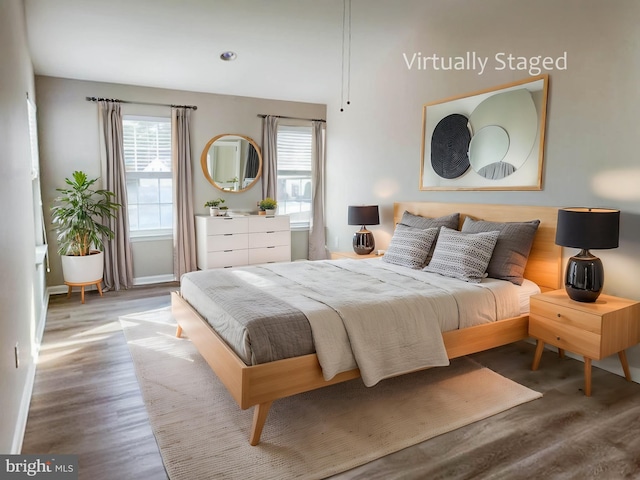 bedroom with wood-type flooring