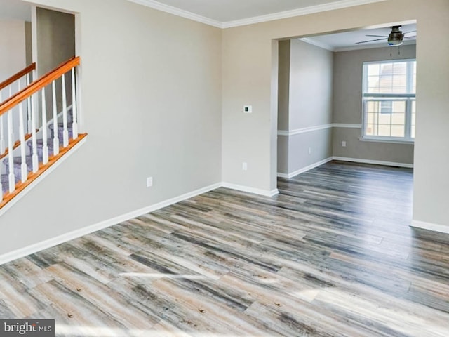 spare room with hardwood / wood-style flooring, ceiling fan, and ornamental molding