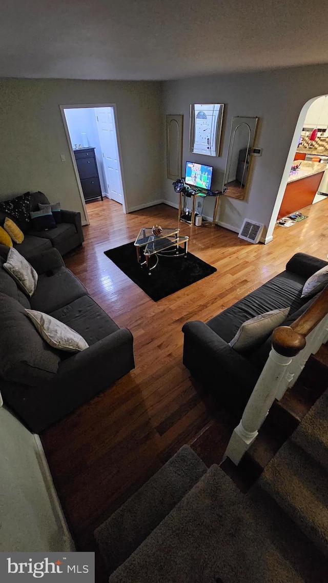 living room with wood-type flooring