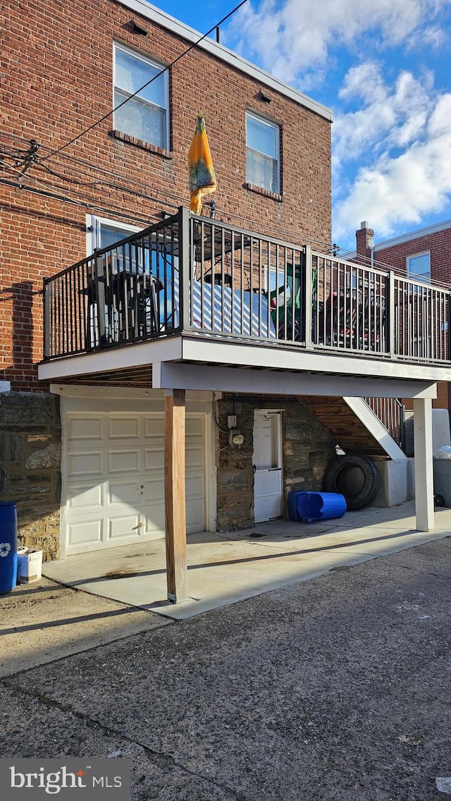 back of house with a garage