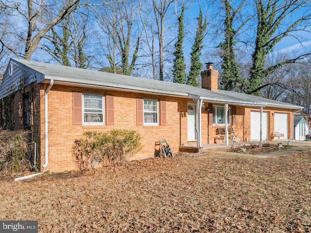 ranch-style house with a garage and covered porch