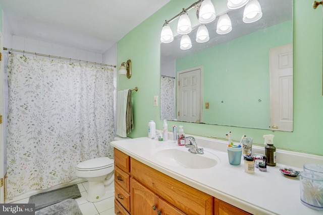 bathroom with vanity, tile patterned flooring, toilet, and walk in shower