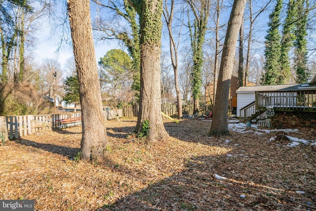 view of yard featuring a deck