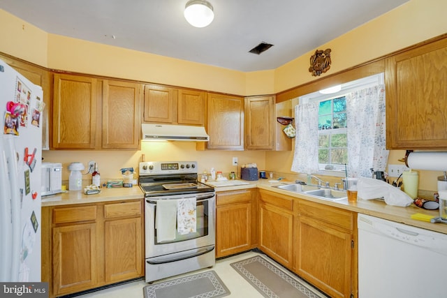 kitchen with white appliances and sink