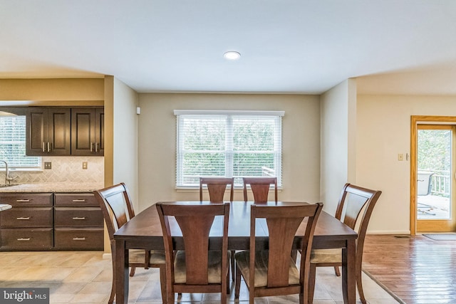 tiled dining space with sink