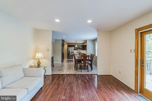 living room with dark hardwood / wood-style floors