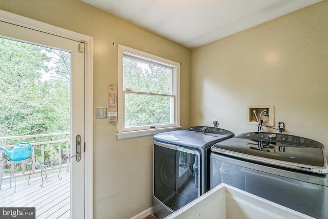 laundry room with separate washer and dryer and sink