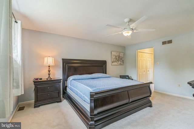 carpeted bedroom with a closet and ceiling fan