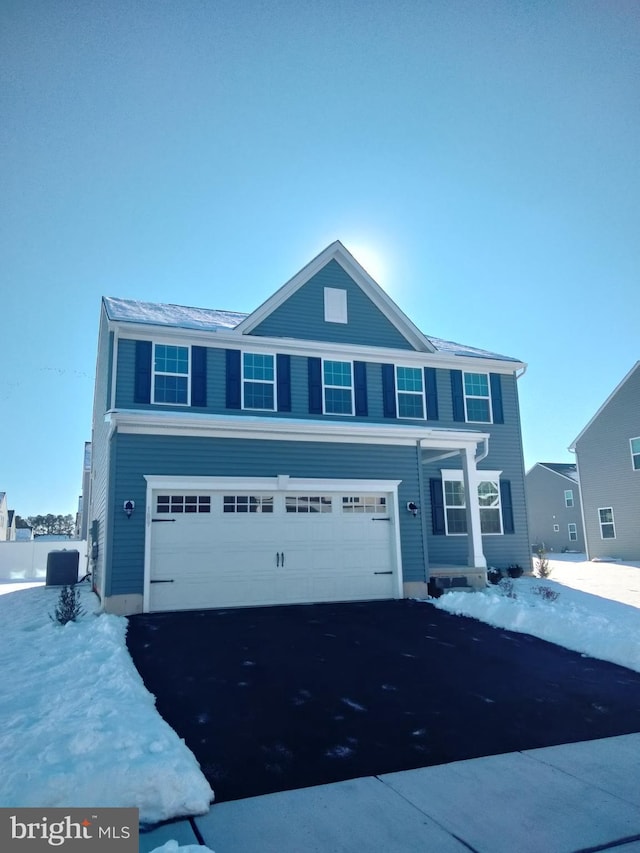 front of property with a garage