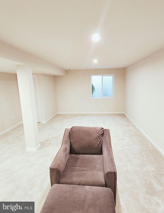 sitting room with light colored carpet