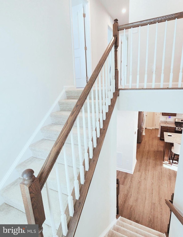 stairway with wood-type flooring