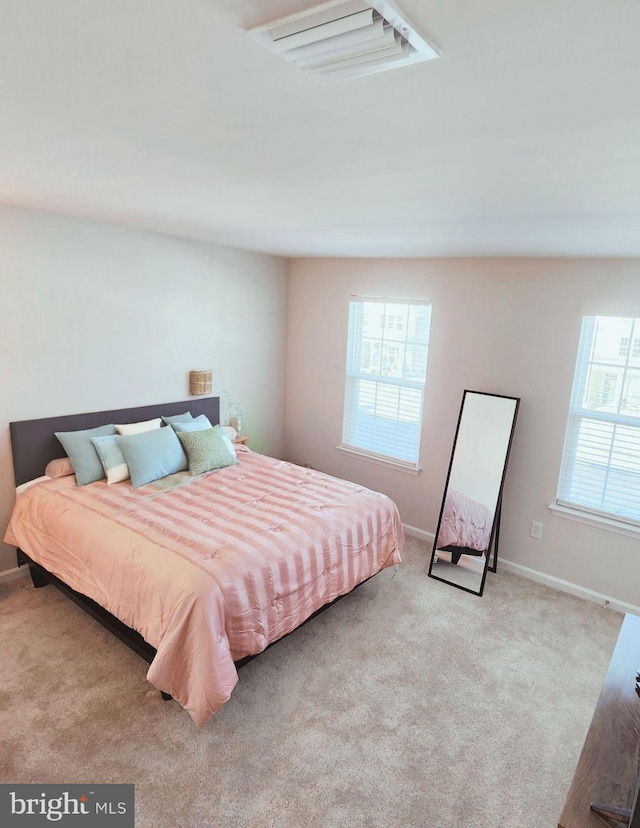 bedroom with light colored carpet