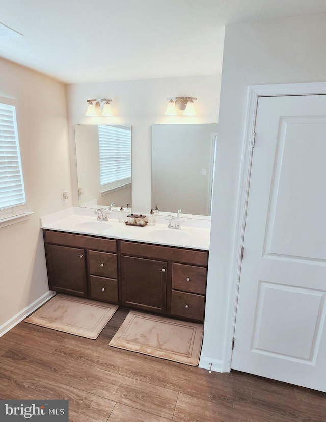 bathroom featuring hardwood / wood-style flooring and vanity