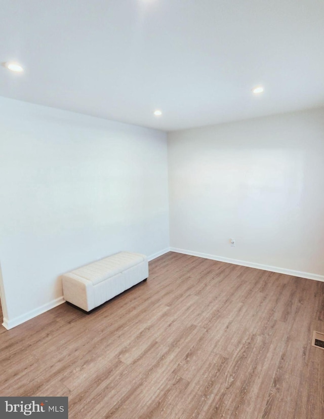 spare room featuring light hardwood / wood-style flooring