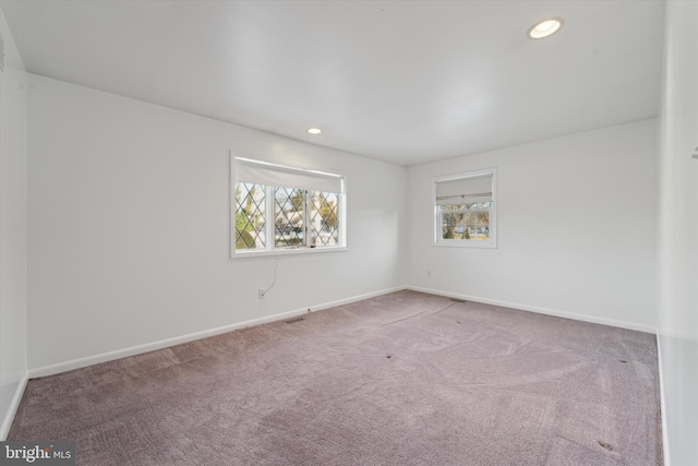 empty room with carpet flooring