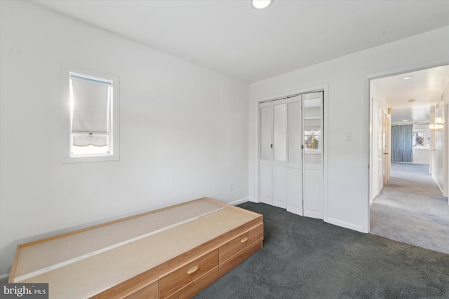 carpeted bedroom featuring a closet