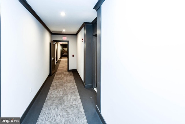 hallway featuring ornamental molding