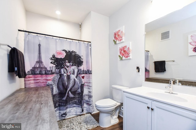 bathroom featuring hardwood / wood-style floors, vanity, and toilet