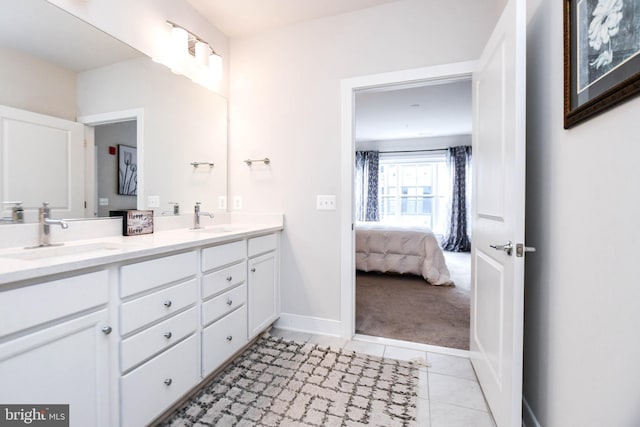 bathroom with tile patterned floors and vanity