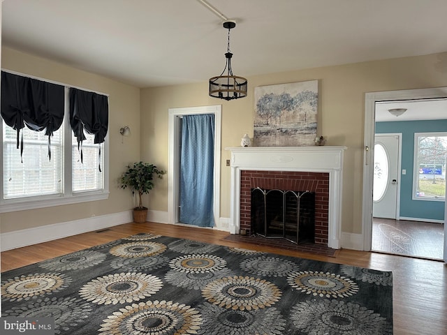 living room featuring hardwood / wood-style flooring and a fireplace