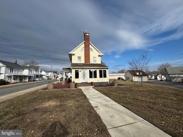 view of front of home with a front lawn