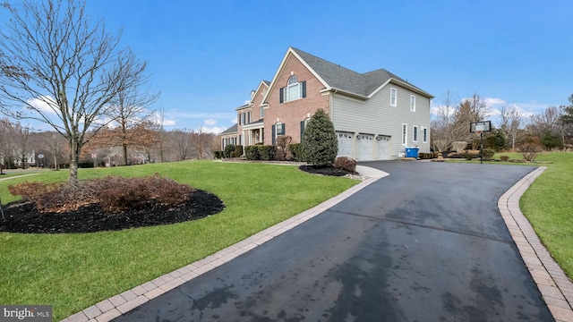 view of side of home featuring a garage and a lawn