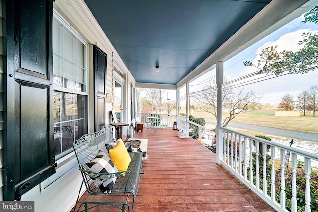 wooden terrace with a porch