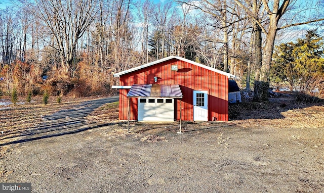 view of outbuilding with an outbuilding and driveway