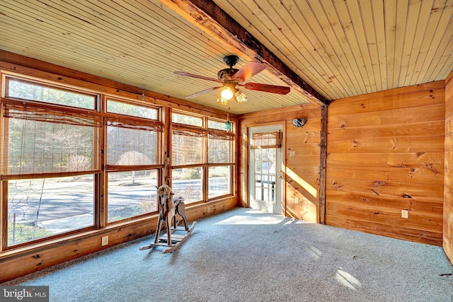 interior space featuring wooden ceiling, beamed ceiling, and ceiling fan