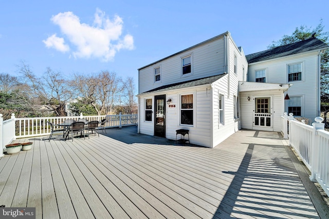 wooden terrace featuring outdoor dining area