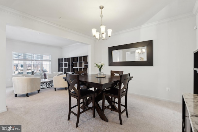 dining room featuring an inviting chandelier, crown molding, and light colored carpet