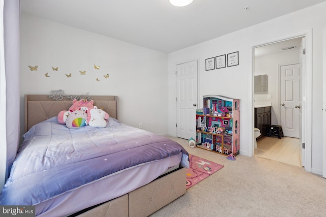 bedroom featuring ensuite bath