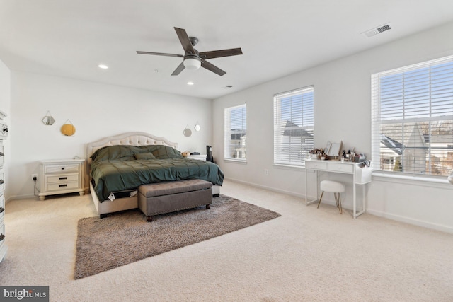 carpeted bedroom featuring ceiling fan