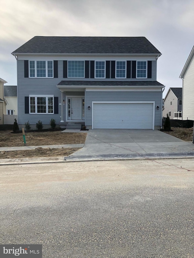 view of front of property with a garage