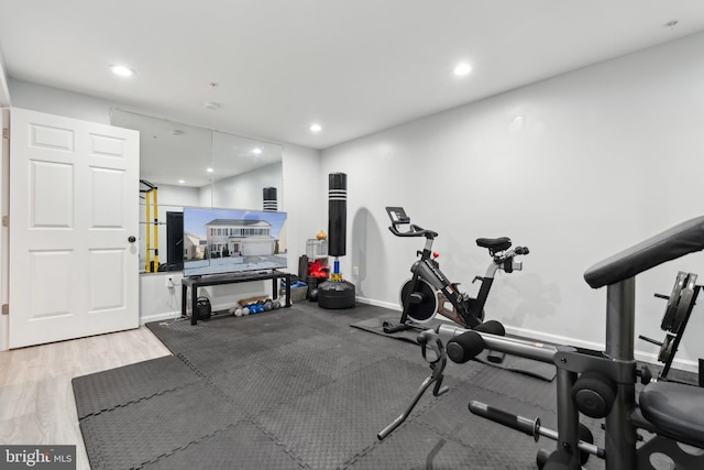 exercise area featuring light hardwood / wood-style floors