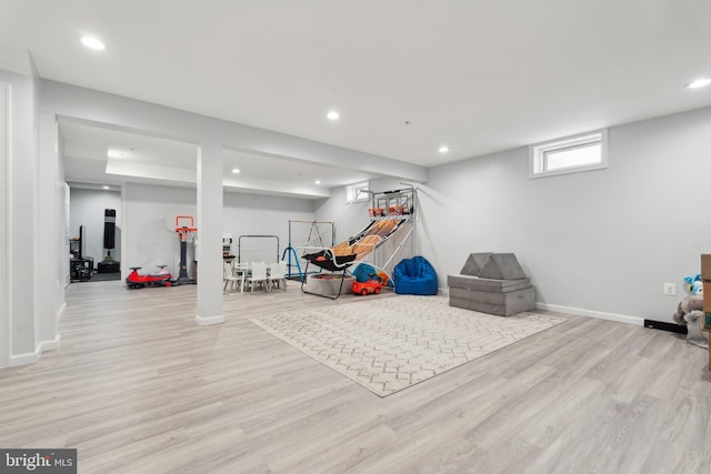 rec room with light hardwood / wood-style flooring