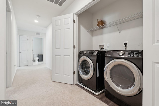 laundry room featuring carpet flooring and washing machine and clothes dryer