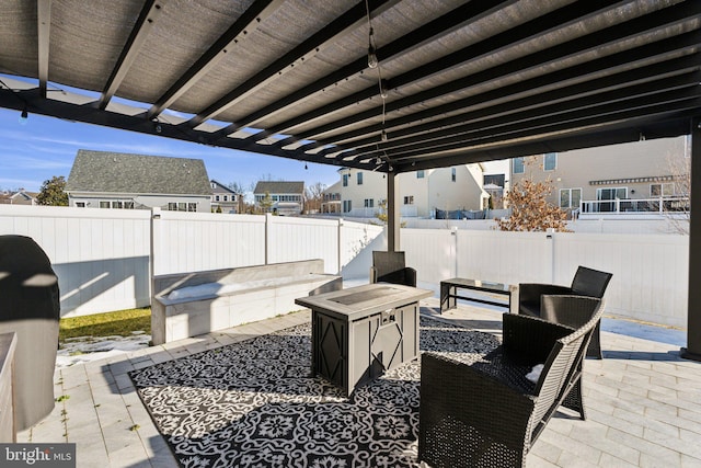 view of patio featuring a pergola and an outdoor fire pit