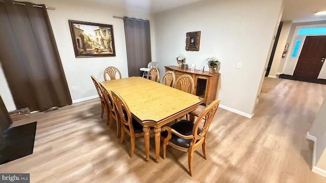 dining area with light wood-type flooring