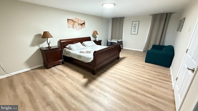 bedroom featuring light hardwood / wood-style floors