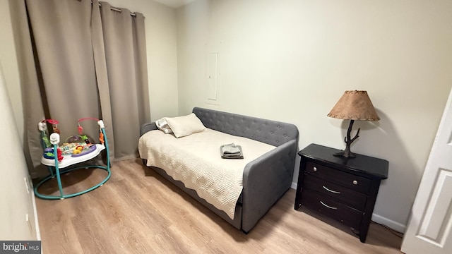 bedroom with light hardwood / wood-style floors